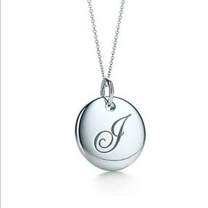 Tiffany’s letter “J” disc necklace